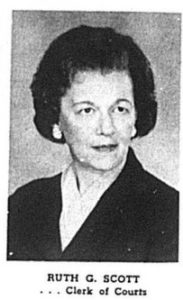 Portrait of a middle-aged woman in a dark jacket and light blouse, facing slightly right.